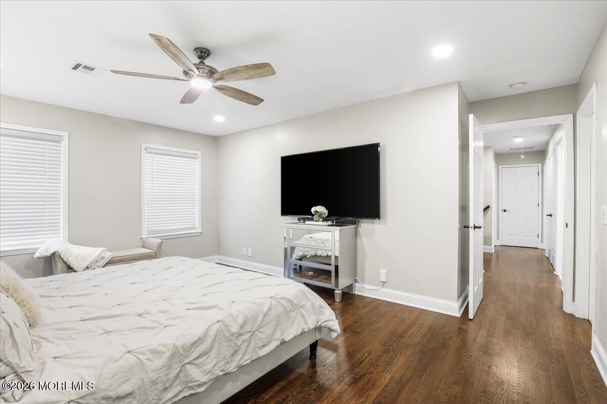 25 Community Place Long Branch, NJ 07740 - Photo 18 of 35 a bedroom with a flat screen television and a bed