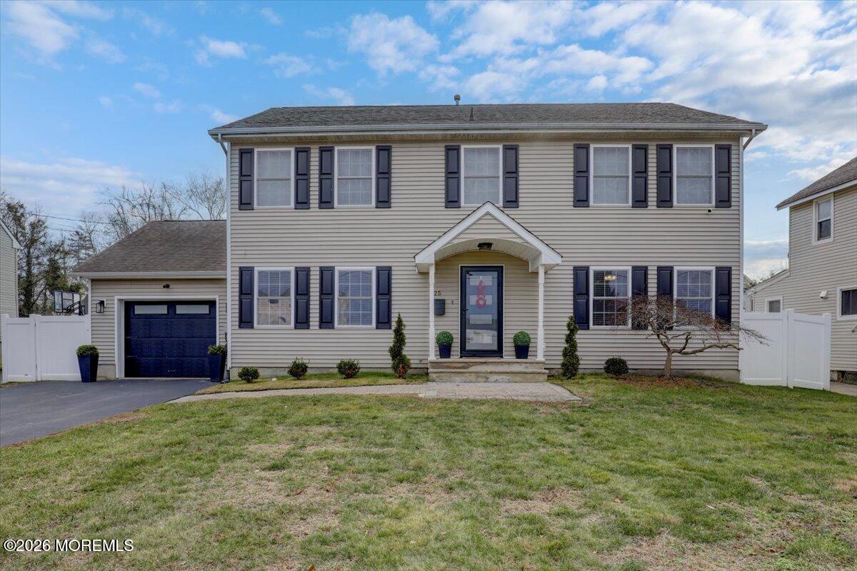 25 Community Place Long Branch, NJ 07740 - Photo 3 of 35 a front view of a house with yard and porch