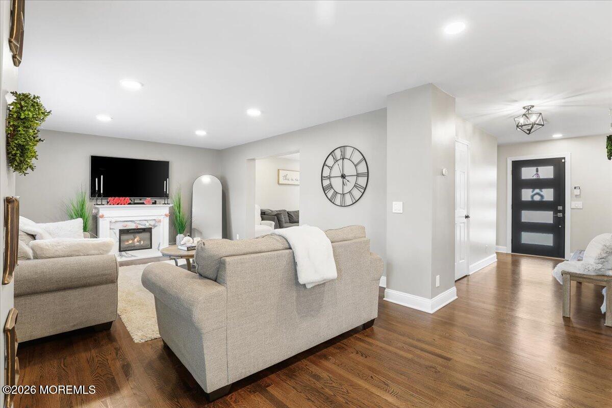 25 Community Place Long Branch, NJ 07740 - Photo 8 of 35 a living room with furniture and a flat screen tv