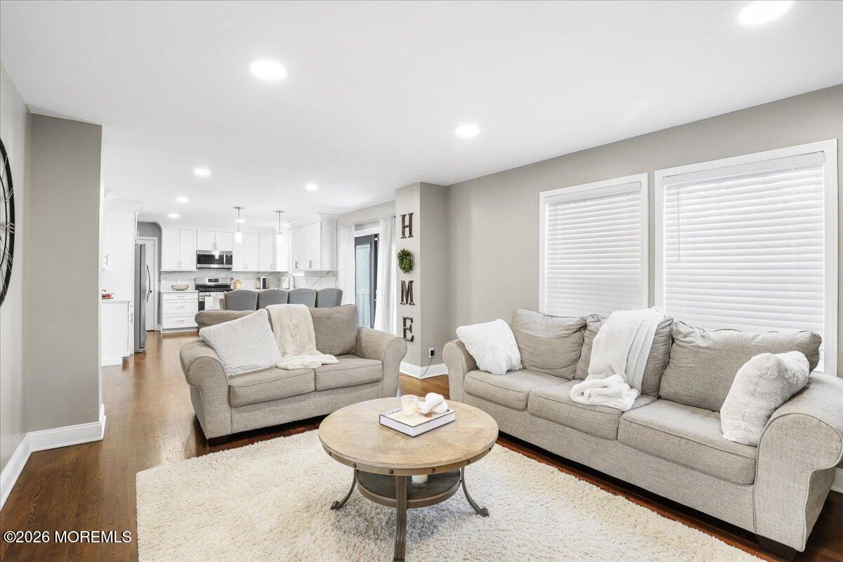 25 Community Place Long Branch, NJ 07740 - Photo 9 of 35 a living room with furniture and a large window