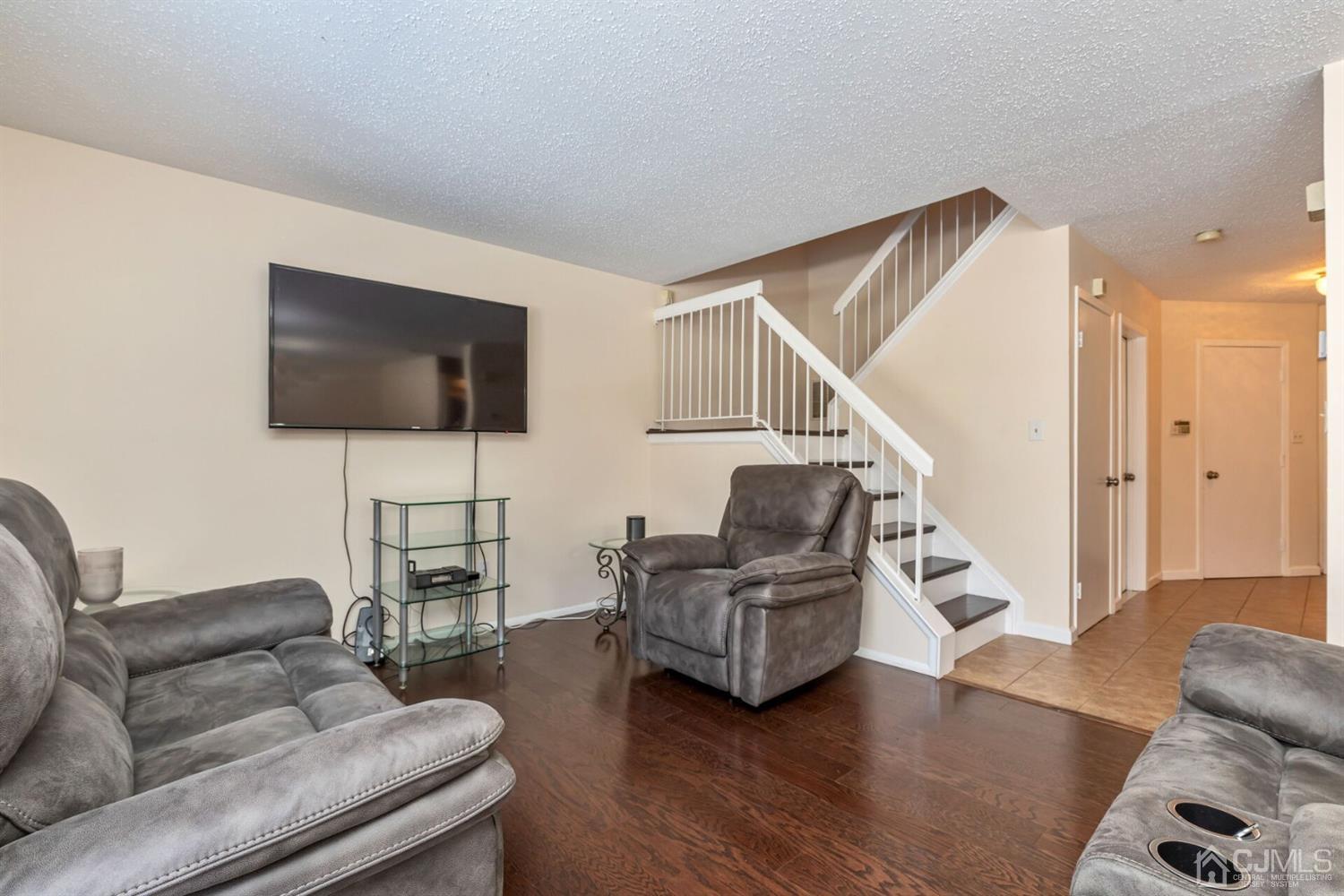 209 Nebula Road Piscataway, NJ 08854 - Photo 8 of 17 a living room with furniture and a flat screen tv
