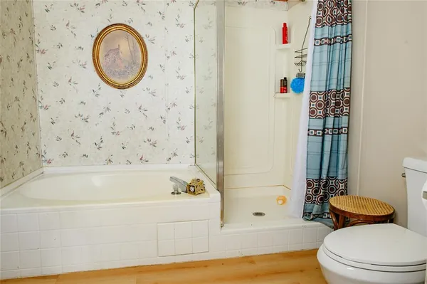 a en suite bathroom with a sink and a mirror