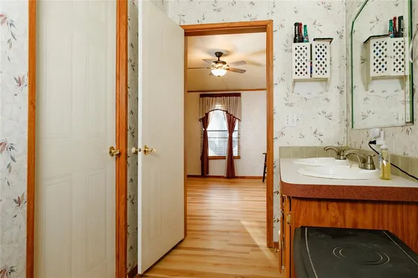 a view of a room with a table and windows