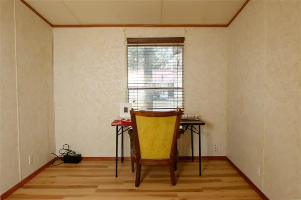 a view of an entryway with wooden floor