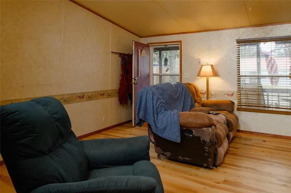 a living room with a couch and a window