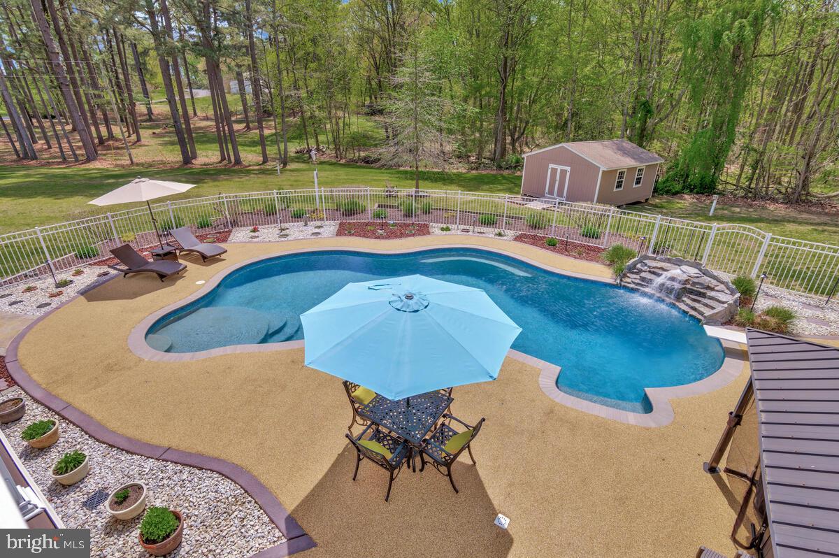 2720 Emmanuel Church Road Huntingtown, MD 20639 - Photo 22 of 85 a view of a swimming pool with a patio