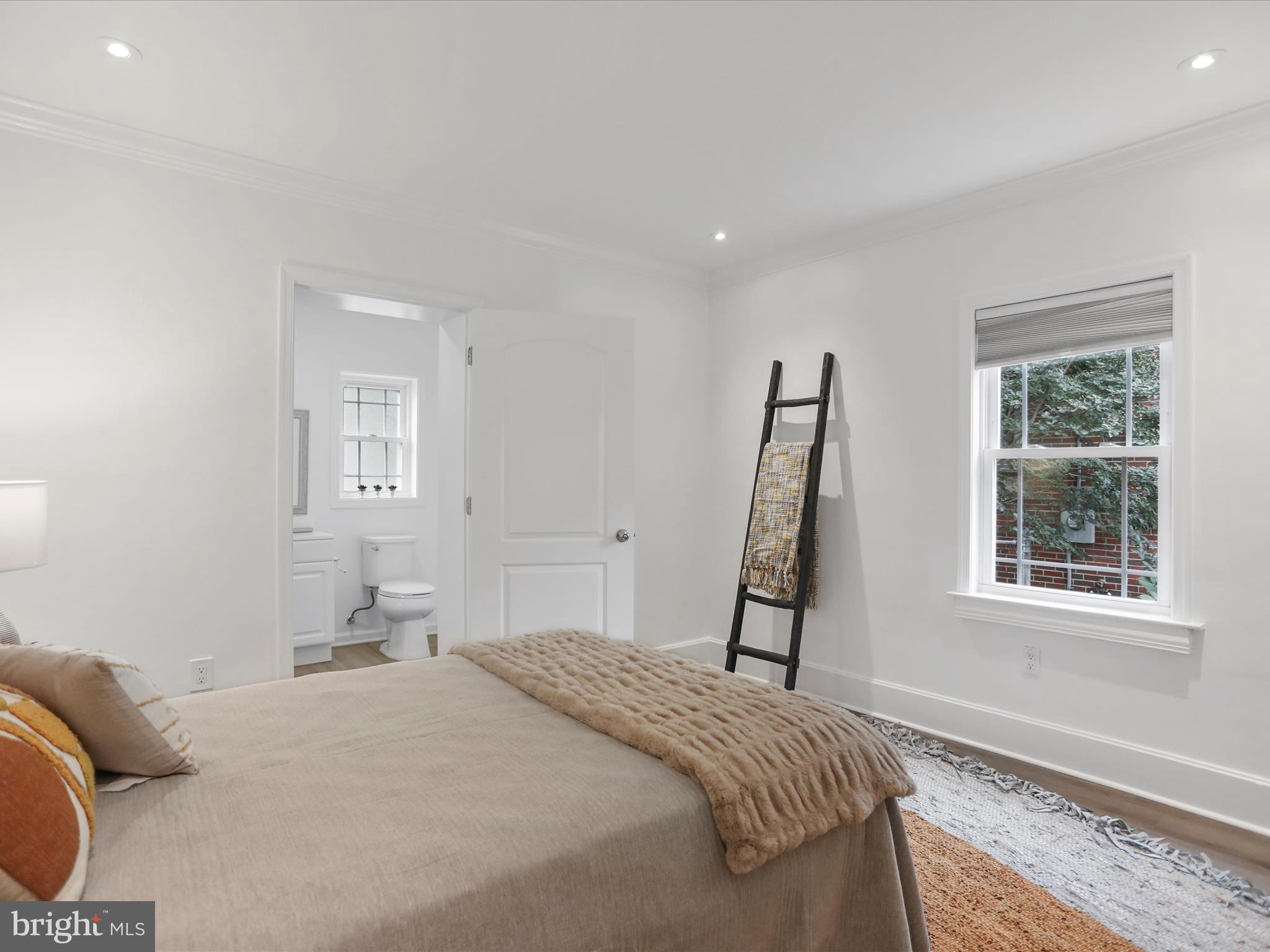 102 Frederick Avenue Frederick, MD 21701 - Photo 14 of 55 a bedroom with a bed and a window