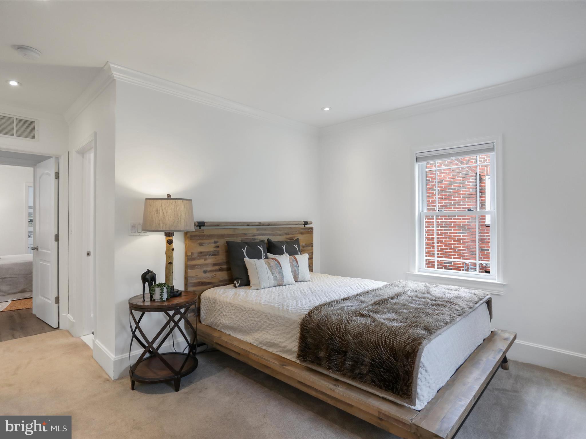 102 Frederick Avenue Frederick, MD 21701 - Photo 16 of 55 a bedroom with a bed and a window