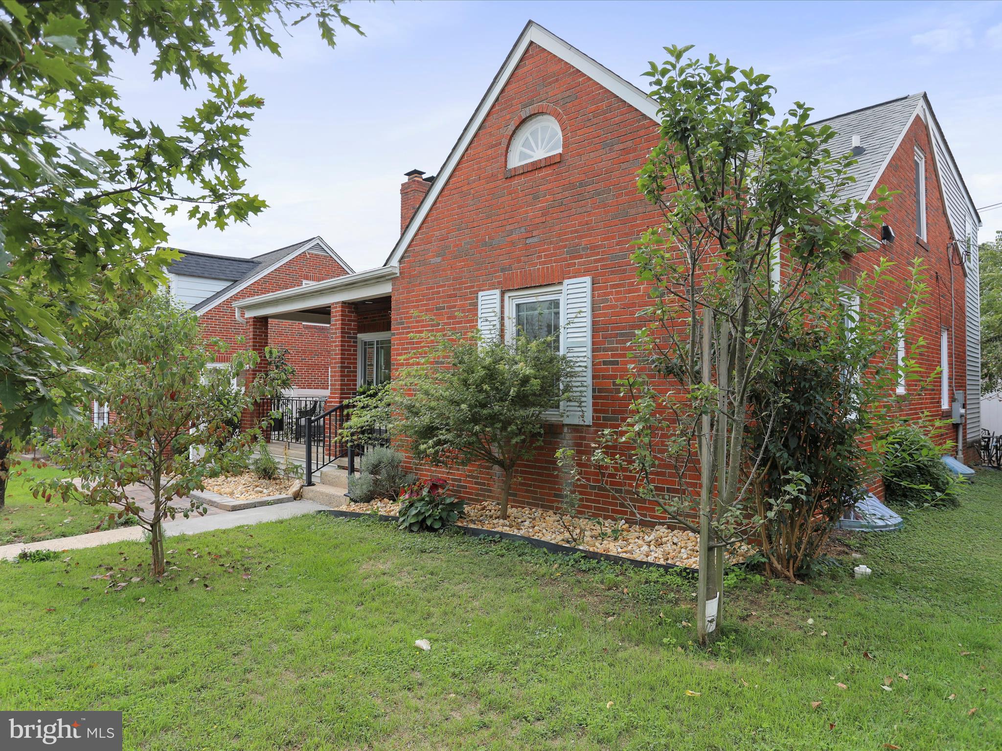 102 Frederick Avenue Frederick, MD 21701 - Photo 2 of 55 a front view of a house with a garden
