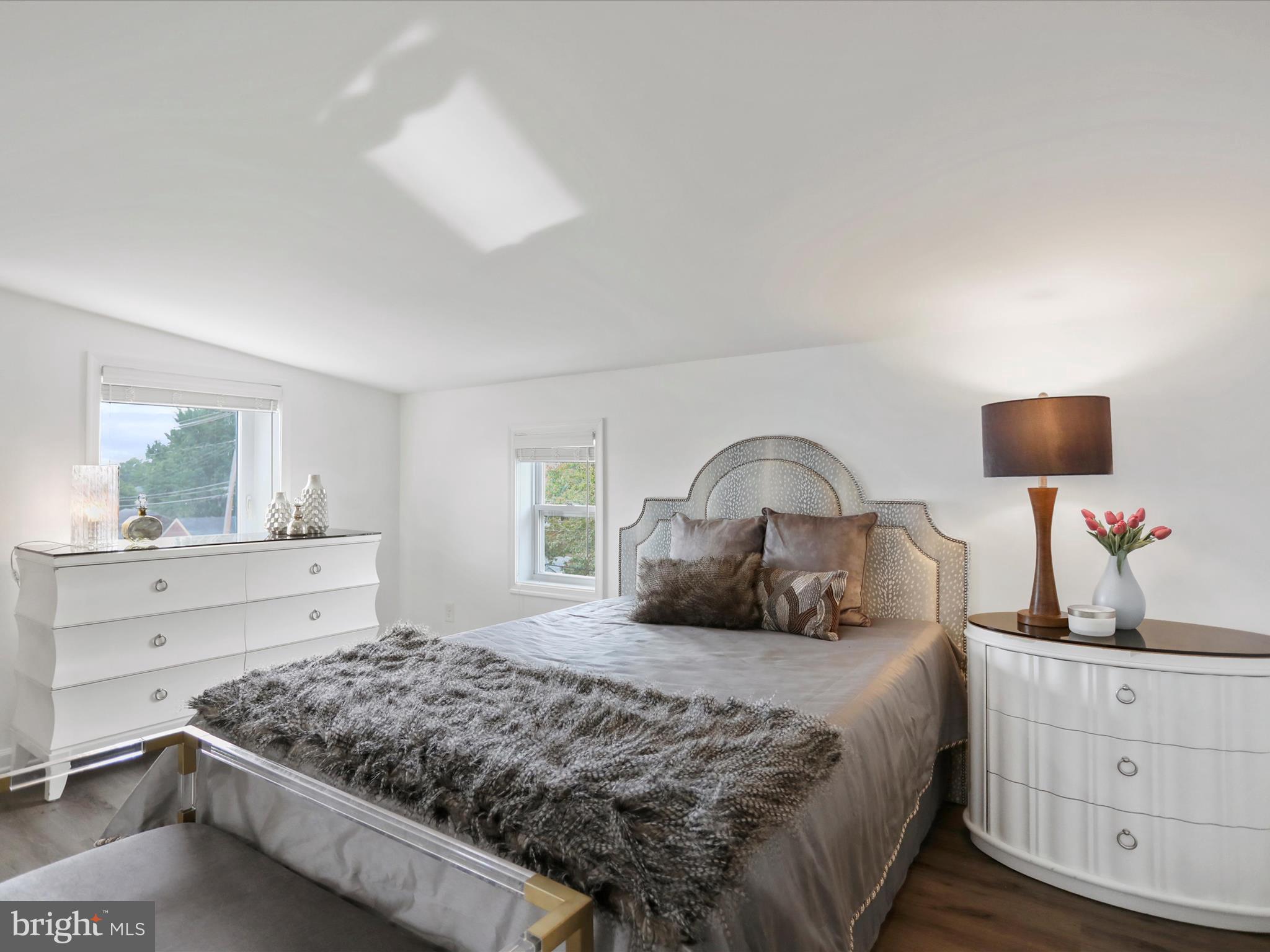 102 Frederick Avenue Frederick, MD 21701 - Photo 23 of 55 a bedroom with a bed and a dresser
