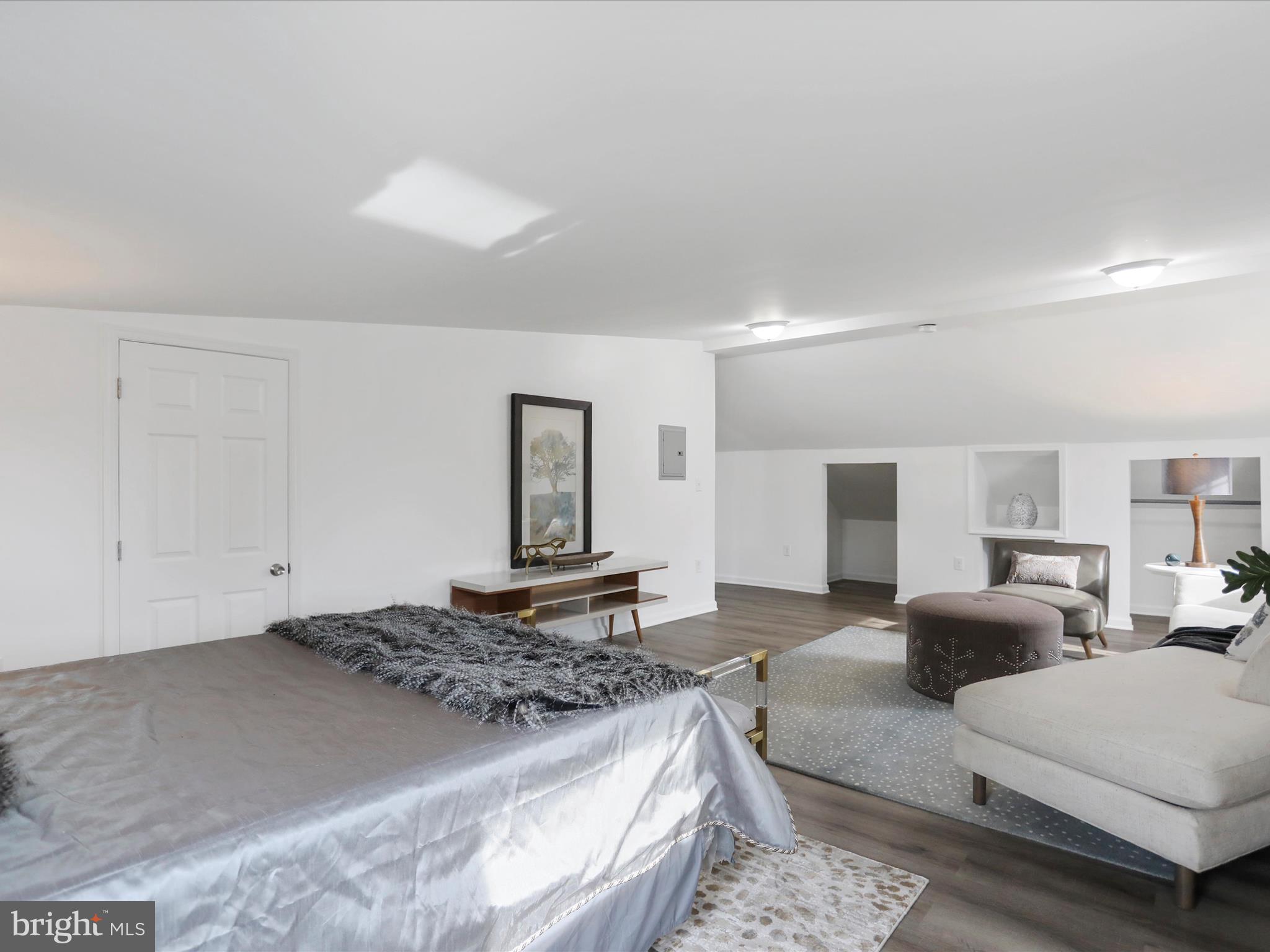 102 Frederick Avenue Frederick, MD 21701 - Photo 24 of 55 a living room with furniture and a lamp
