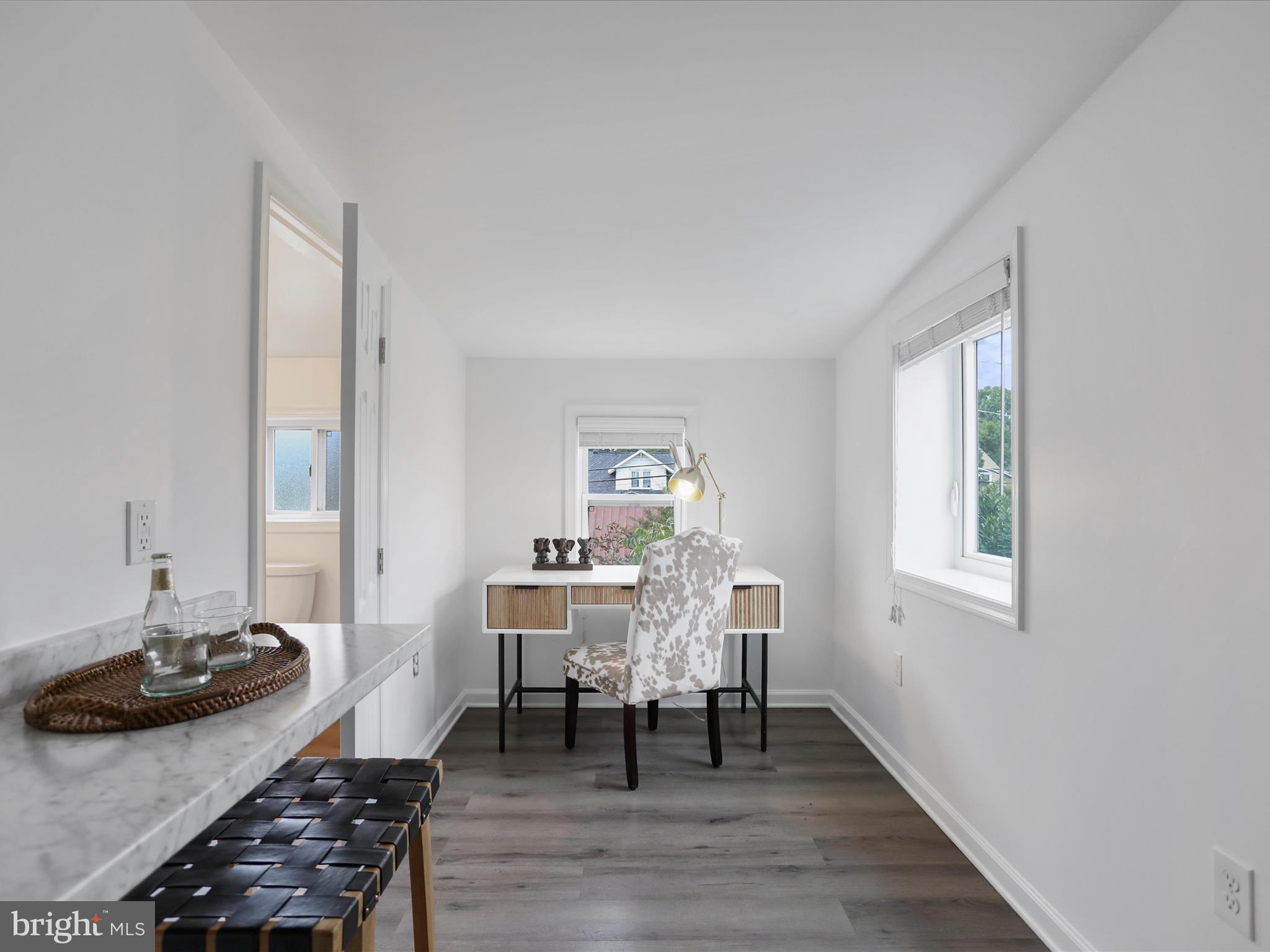 102 Frederick Avenue Frederick, MD 21701 - Photo 26 of 55 a workspace with wooden floor and a window