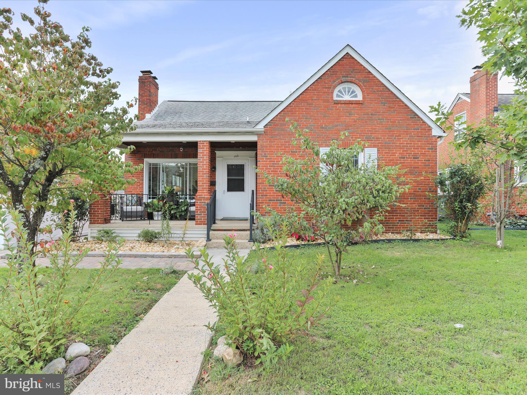 102 Frederick Avenue Frederick, MD 21701 - Photo 3 of 55 a front view of a house with a yard