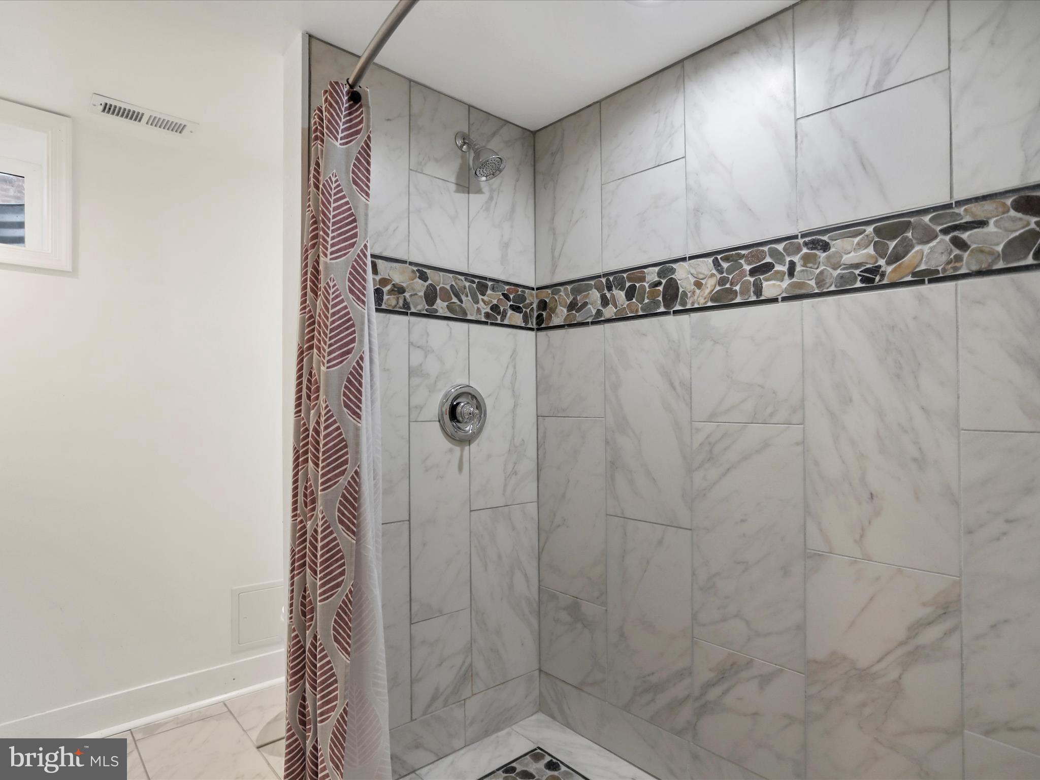 102 Frederick Avenue Frederick, MD 21701 - Photo 32 of 55 a bathroom with a shower and a sink