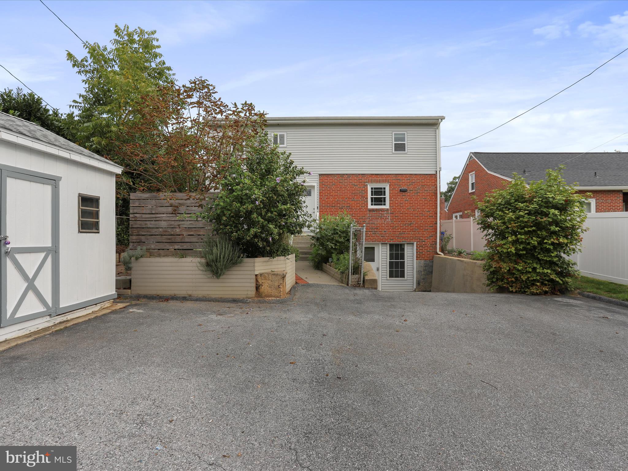 102 Frederick Avenue Frederick, MD 21701 - Photo 45 of 55 a front view of a house with a yard and garage