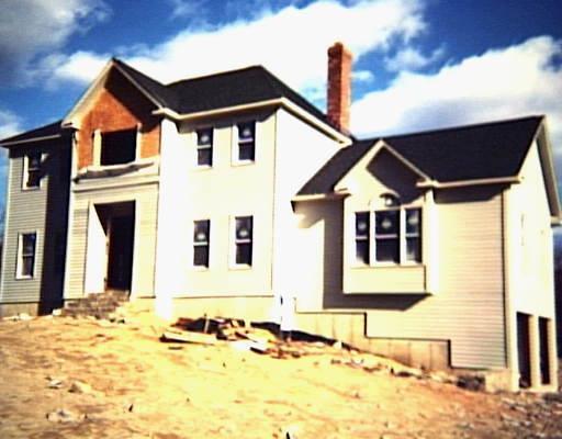 5 Huntingtown Road Monroe, CT 06468 - Photo 1 of 1 a front view of a house with a yard