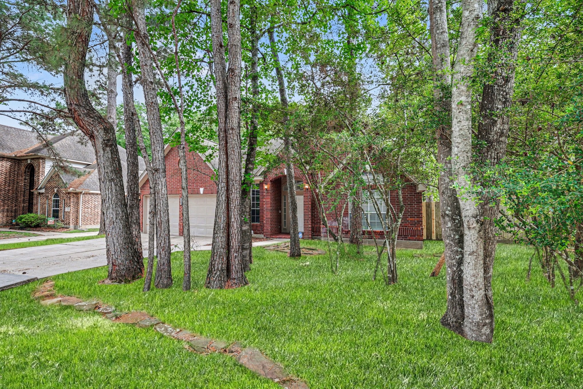 215 Bristol Bend Circle Spring, TX 77382 - Photo 25 of 25 a view of a backyard with large trees and a barn