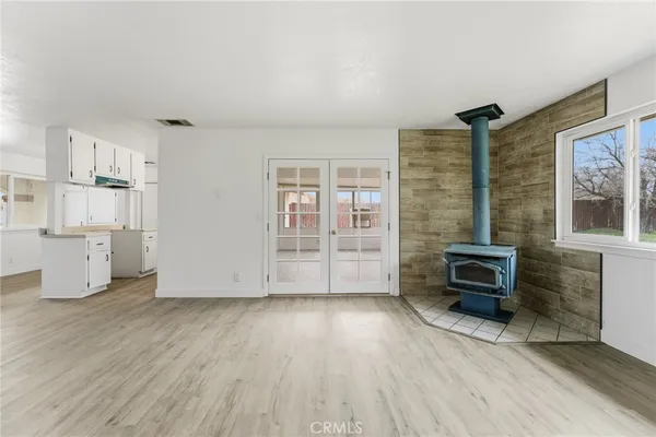 an empty room with furniture and windows