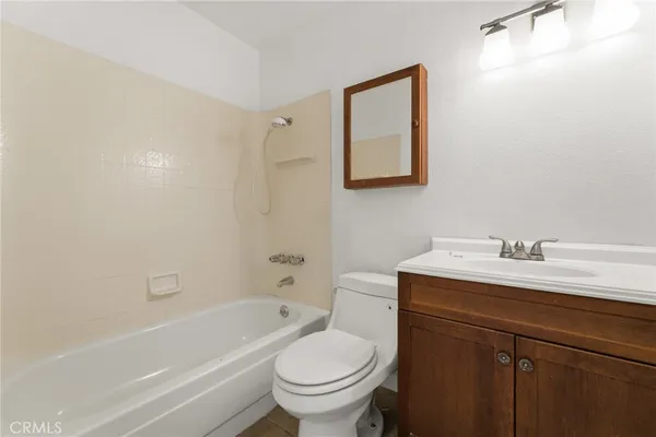 a bathroom with a sink a toilet and a bathtub