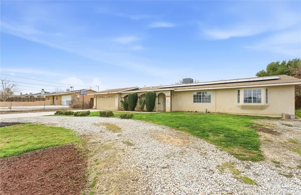 a view of a house with a big yard