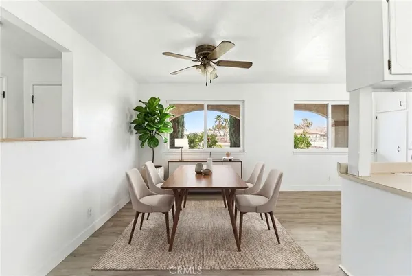 a dining room with furniture and window