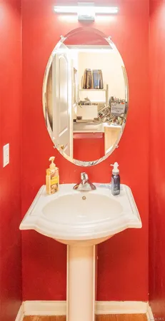 a view of staircase with railing and white walls