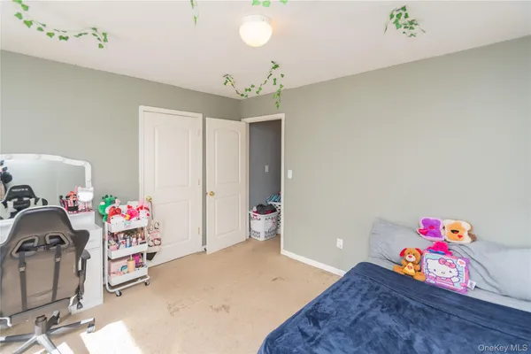 a bedroom with a bed and a cabinets
