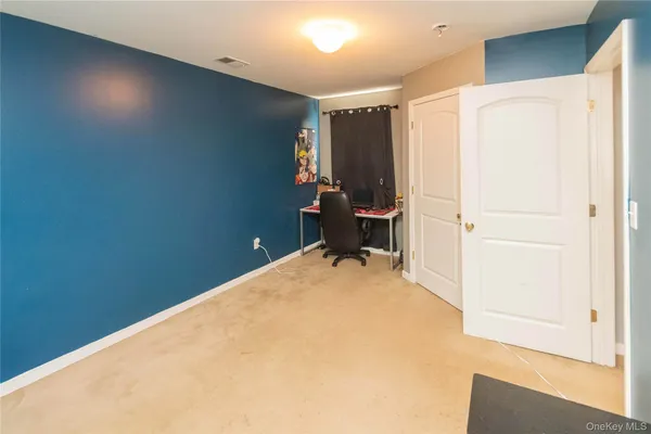 a view of a room with a bed