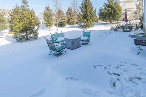 a building outdoor space with patio furniture and potted plants