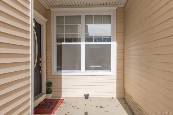 a view of a door and a window