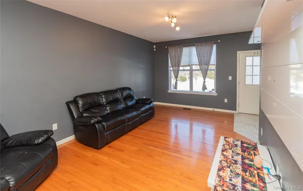 a living room with furniture and a rug