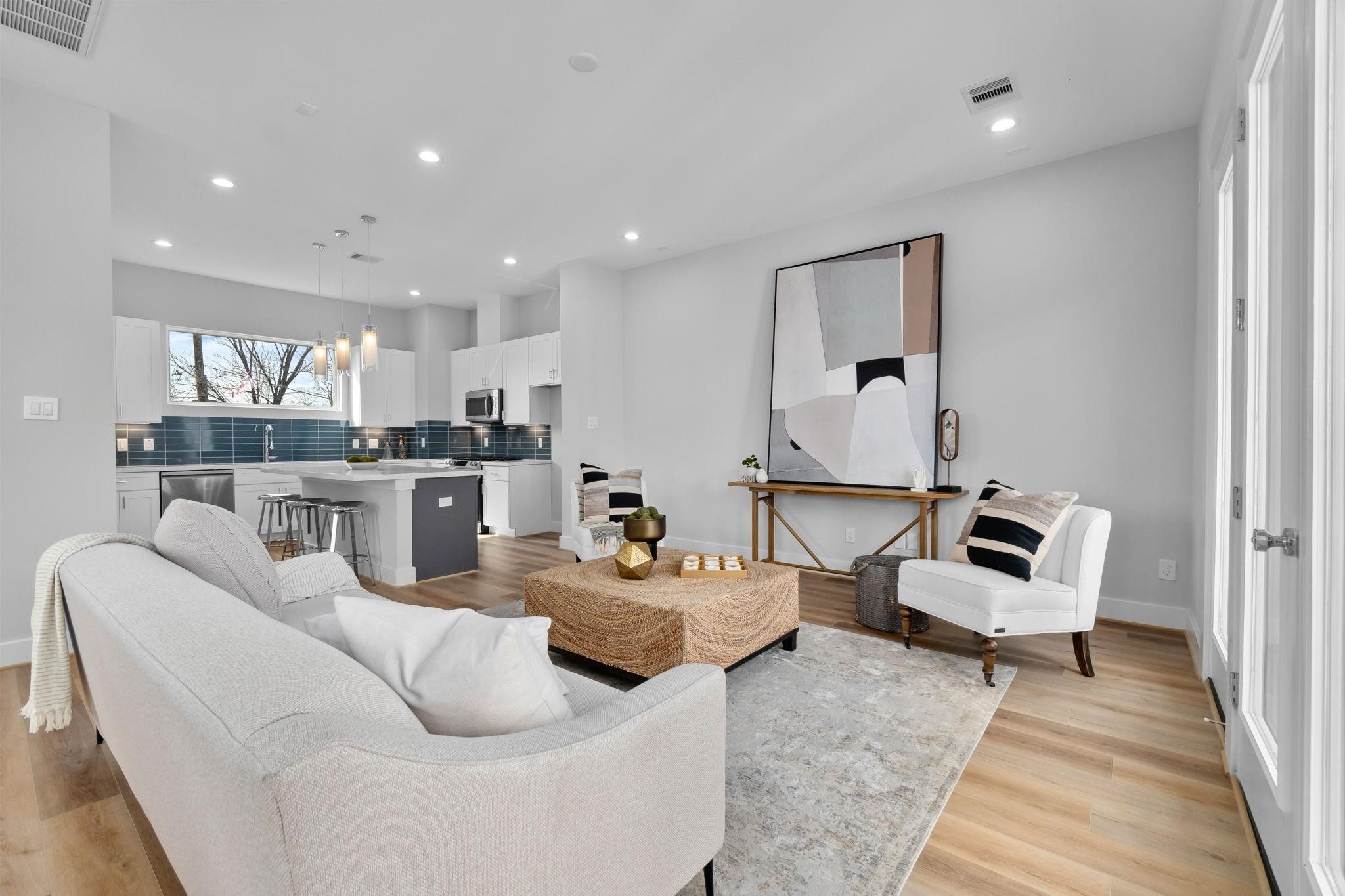 903 Quitman Street, Unit B Houston, TX 77009 - Photo 5 of 23 Well-designed living area with an open layout that connects effortlessly to the kitchen, offering both functionality and flexibility.