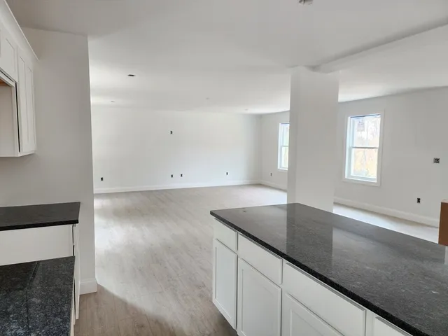 an empty room with wooden floor