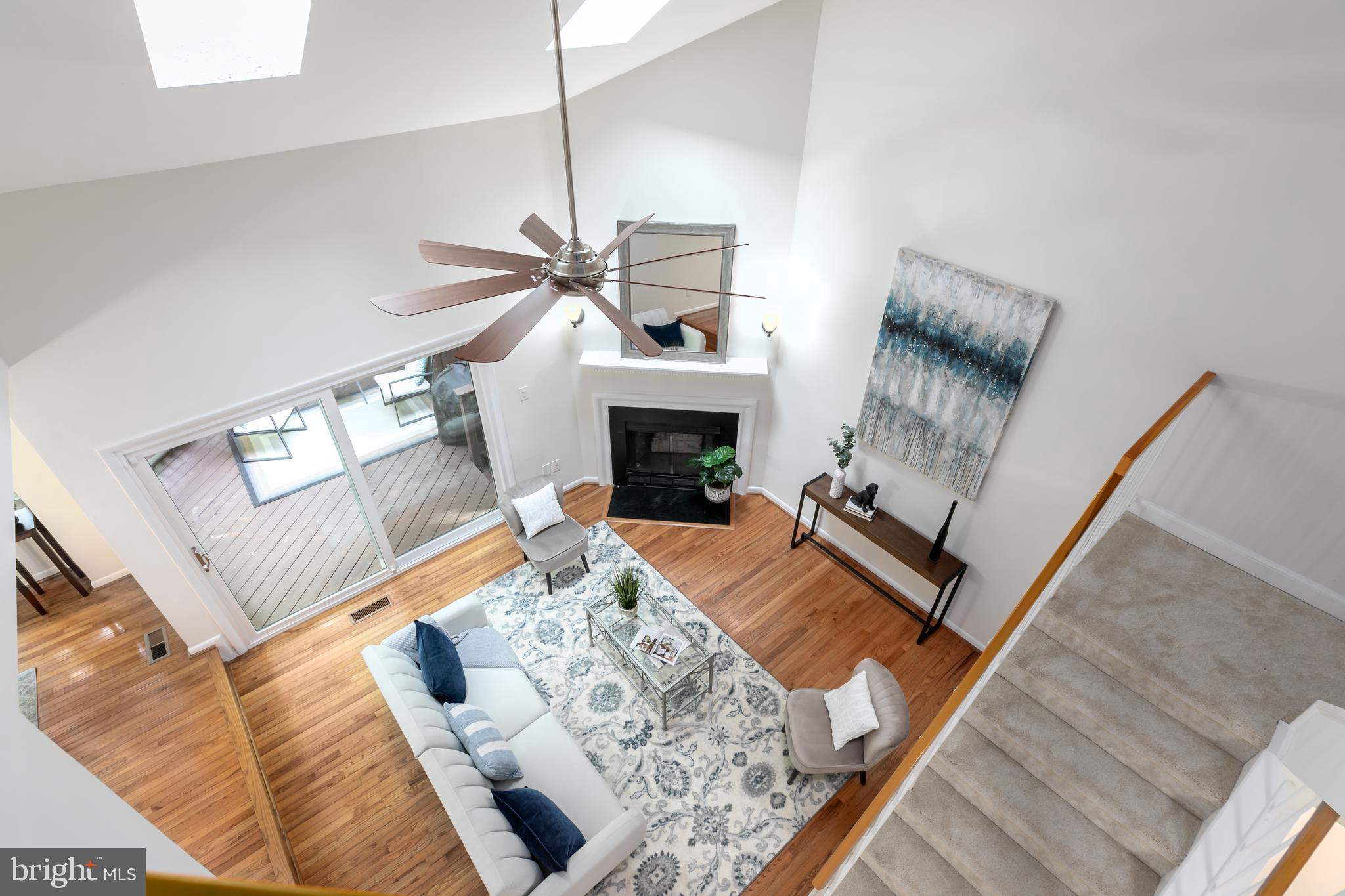 11554 Brass Lantern Court Reston, VA 20194 - Photo 13 of 47 a living room with furniture and a fireplace