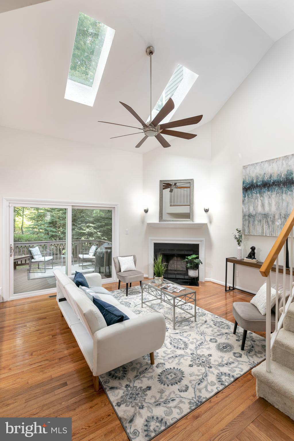 11554 Brass Lantern Court Reston, VA 20194 - Photo 15 of 47 a living room with fireplace furniture and a large window
