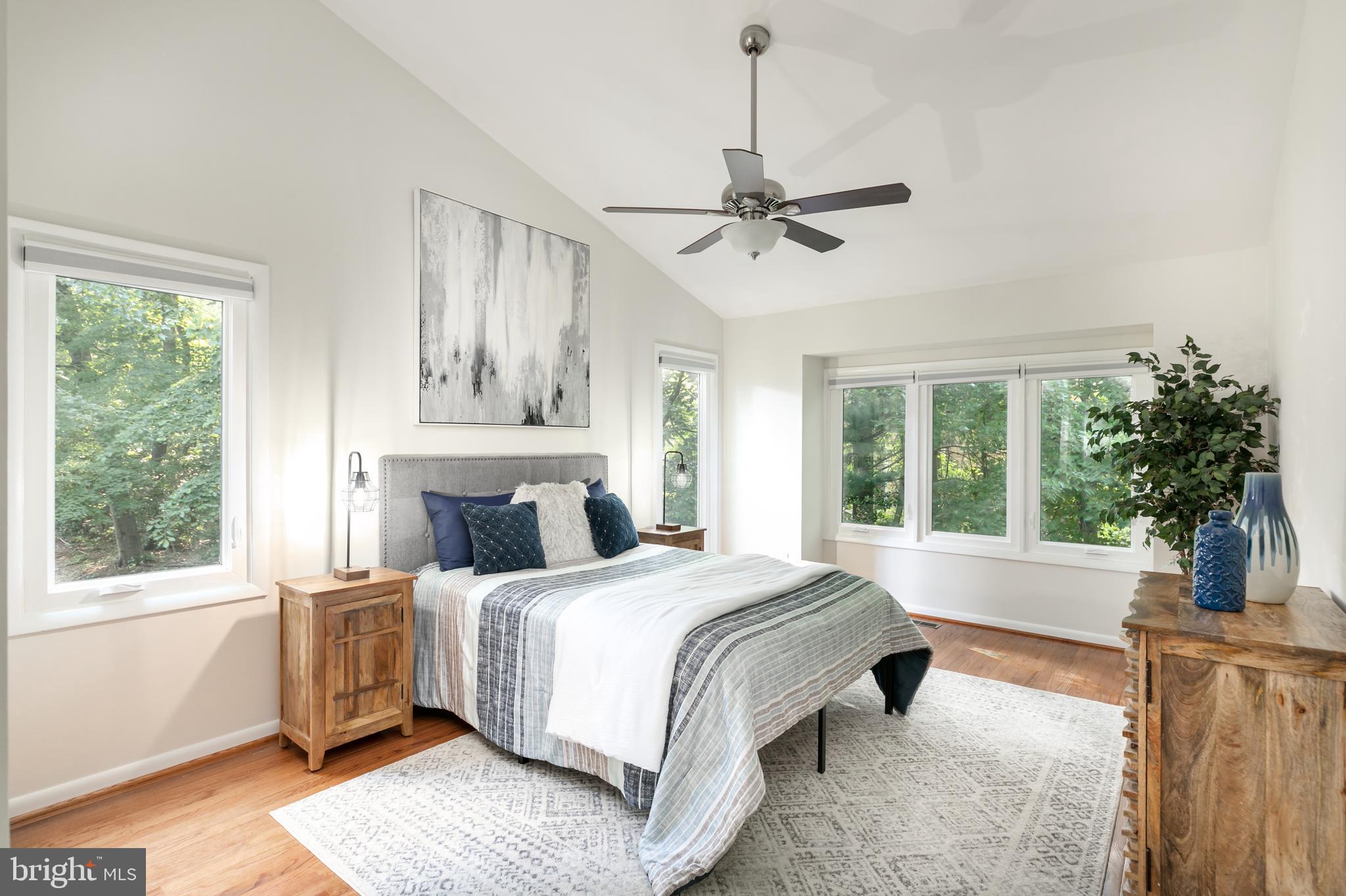 11554 Brass Lantern Court Reston, VA 20194 - Photo 16 of 47 a bedroom with a large bed and a window