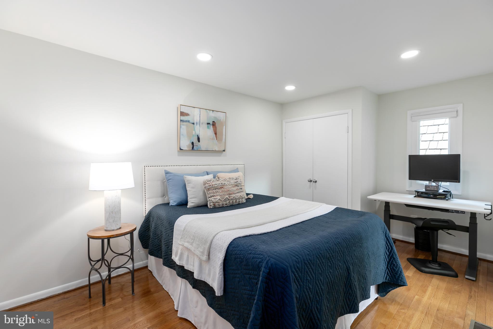 11554 Brass Lantern Court Reston, VA 20194 - Photo 19 of 47 a bedroom with a bed and a desk