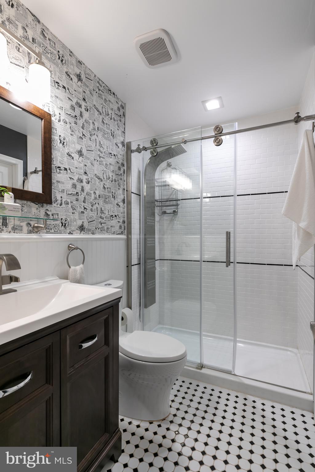 11554 Brass Lantern Court Reston, VA 20194 - Photo 21 of 47 a bathroom with a sink a toilet a mirror and shower