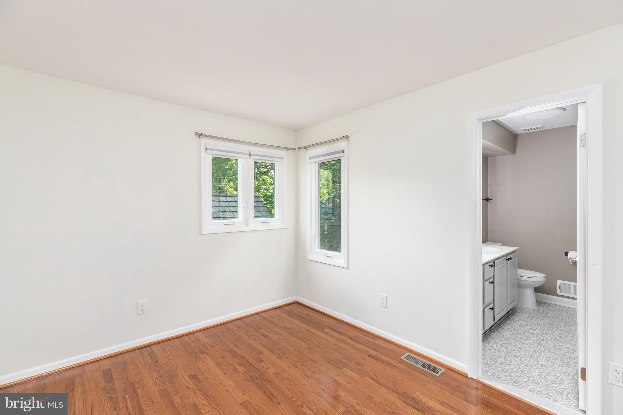 11554 Brass Lantern Court Reston, VA 20194 - Photo 25 of 47 a view of a room that has a bed and a window in it