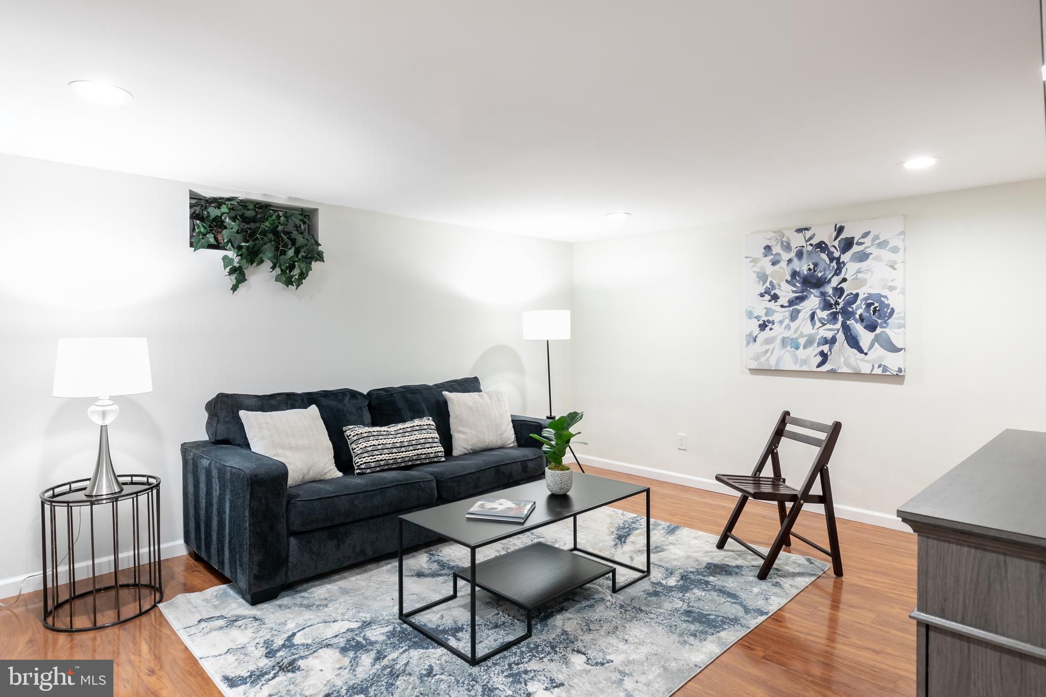 11554 Brass Lantern Court Reston, VA 20194 - Photo 31 of 47 a living room with furniture and wooden floor