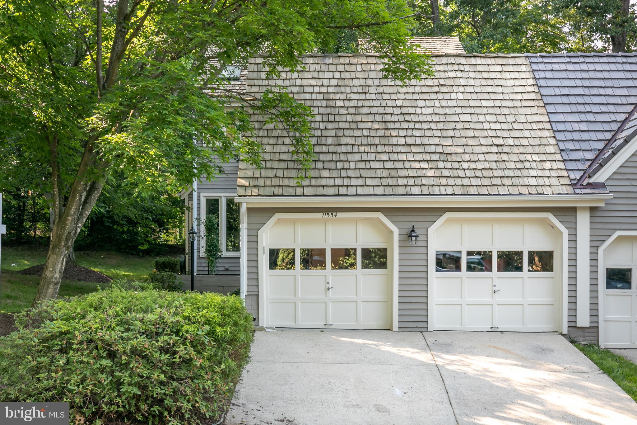 11554 Brass Lantern Court Reston, VA 20194 - Photo 38 of 47 a front view of a house with garden
