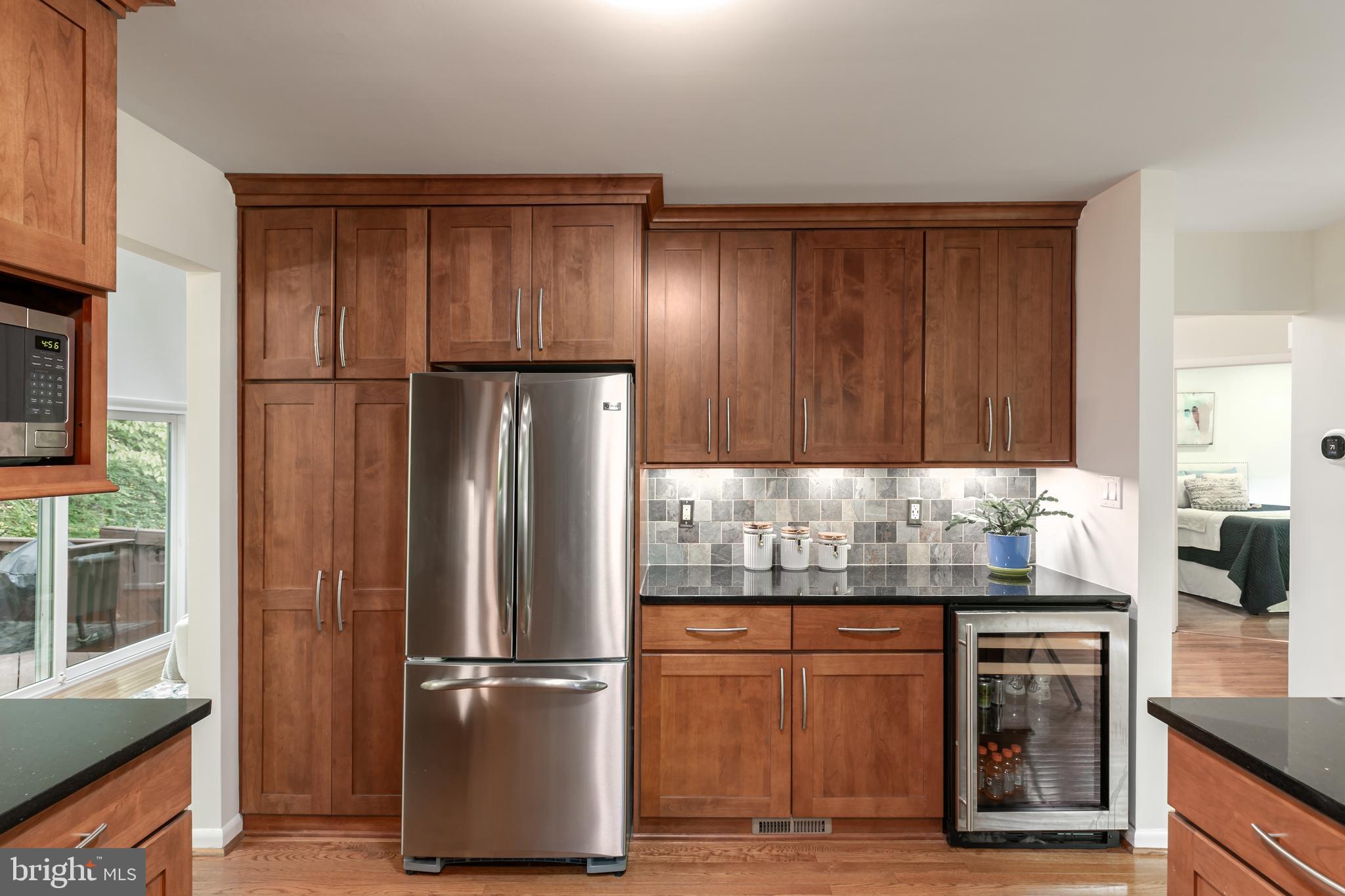 11554 Brass Lantern Court Reston, VA 20194 - Photo 4 of 47 a kitchen with stainless steel appliances granite countertop a refrigerator and a stove