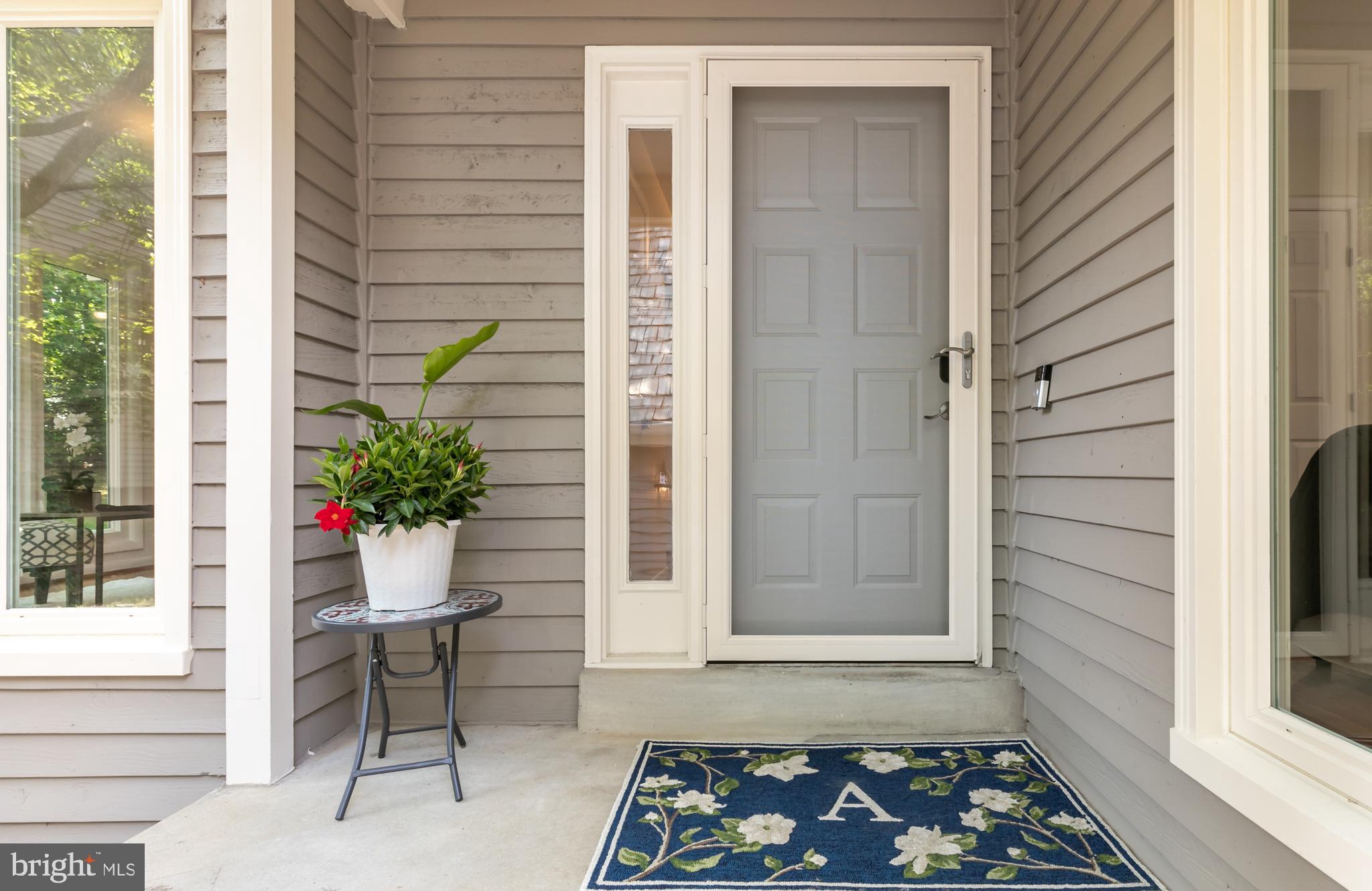 11554 Brass Lantern Court Reston, VA 20194 - Photo 44 of 47 a front view of a house with a potted plant