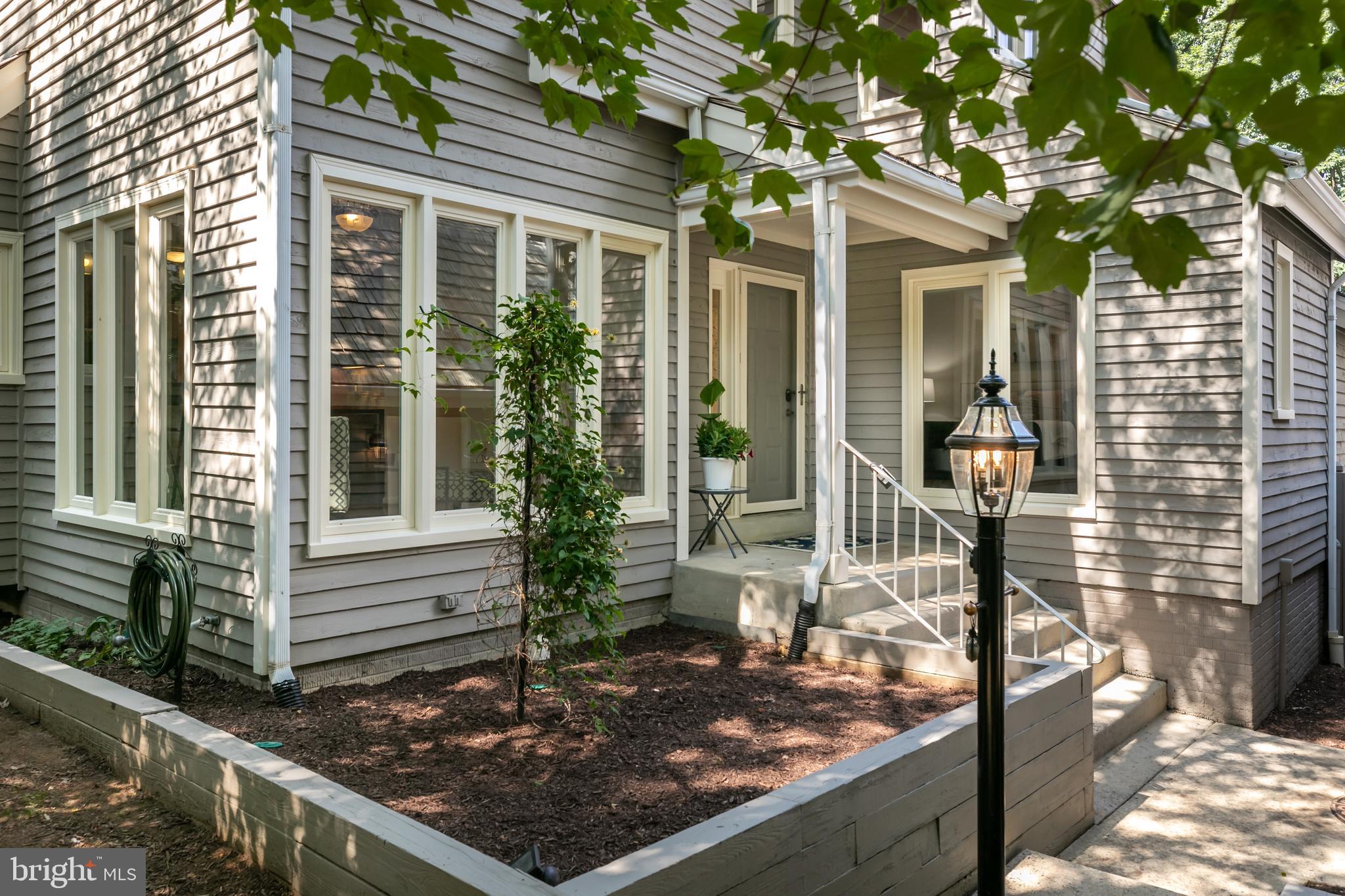 11554 Brass Lantern Court Reston, VA 20194 - Photo 45 of 47 a front view of a house with garden