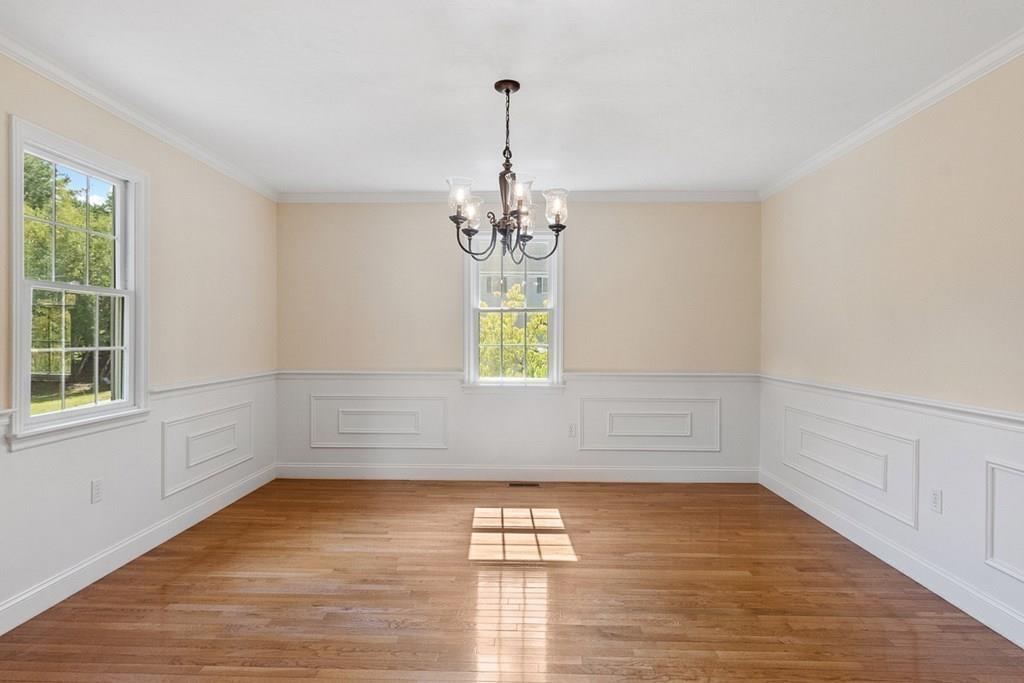 318 Great Road Shirley, MA 01464 - Photo 15 of 36 a view of empty room with wooden floor and fan
