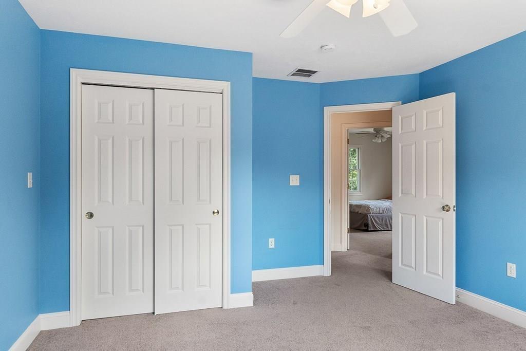 318 Great Road Shirley, MA 01464 - Photo 25 of 36 a view of a hallway with a livingroom and a bathroom