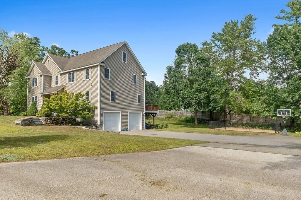 318 Great Road Shirley, MA 01464 - Photo 36 of 36 a front view of a house with a yard and trees