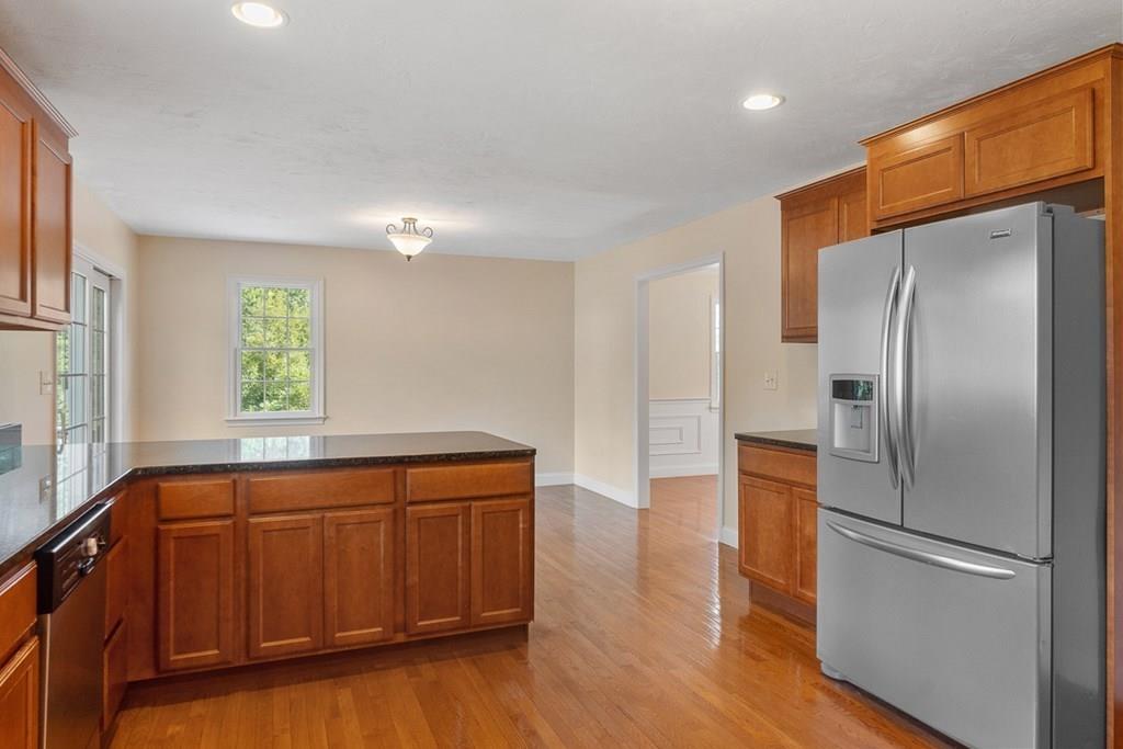 318 Great Road Shirley, MA 01464 - Photo 7 of 36 a kitchen with a refrigerator and a sink