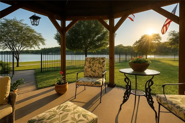 a view of a chairs and table in the balcony