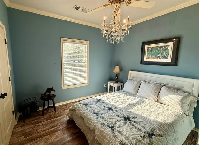 a bedroom with bed and a window